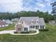 Charming two-story home with stone accents, well-manicured lawn and lovely landscaping details at 114 Saddle Wood Dr, Dallas, GA 30157