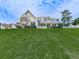 Beautiful home exterior featuring stone accents, manicured lawn and covered entry at 114 Saddle Wood Dr, Dallas, GA 30157