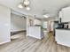 Open concept kitchen with an island, modern appliances, and hardwood floors at 114 Saddle Wood Dr, Dallas, GA 30157