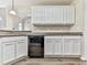 Bright kitchen featuring white cabinetry, stainless steel sink, and modern countertops at 114 Saddle Wood Dr, Dallas, GA 30157