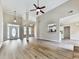 Large living room with high ceilings, hardwood floors, and an open view to the kitchen at 114 Saddle Wood Dr, Dallas, GA 30157