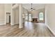Bright living room featuring high ceilings, a stone fireplace, beautiful arch windows and hardwood floors at 114 Saddle Wood Dr, Dallas, GA 30157