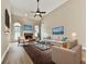 Nicely furnished living room with vaulted ceiling, fireplace, hardwood floors and large windows at 114 Saddle Wood Dr, Dallas, GA 30157
