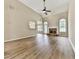 Open living room with vaulted ceilings, a stone fireplace, and large windows offering plenty of natural light at 114 Saddle Wood Dr, Dallas, GA 30157