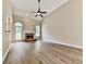 Spacious living room with vaulted ceiling, a fireplace, hardwood floors and large windows at 114 Saddle Wood Dr, Dallas, GA 30157