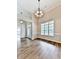 Bright living room featuring vaulted ceilings, large windows, and modern lighting at 114 Saddle Wood Dr, Dallas, GA 30157