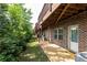 Brick townhouse backyard with green space, patio and covered wood deck at 3133 Quinn Pl, Atlanta, GA 30341