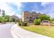 Gated community entrance with brick townhomes and lush landscaping at 3133 Quinn Pl, Atlanta, GA 30341