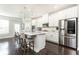 Modern kitchen featuring quartz counters, stainless appliances, and island with seating at 3133 Quinn Pl, Atlanta, GA 30341