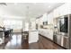 Bright kitchen boasting stainless appliances, island with seating, and easy access to the dining area at 3133 Quinn Pl, Atlanta, GA 30341