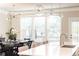 Open concept kitchen and dining area features a large island with seating and contemporary decor and dark wood floors at 3133 Quinn Pl, Atlanta, GA 30341