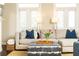 Comfortable living room featuring plush seating, lots of sunlight, and neutral decor at 3133 Quinn Pl, Atlanta, GA 30341