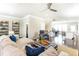 Open-concept living room offering sleek dark hardwood floors, view of kitchen, and neutral color palette at 3133 Quinn Pl, Atlanta, GA 30341