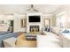 Relaxing living room featuring a fireplace, large sectional, and modern finishes at 3133 Quinn Pl, Atlanta, GA 30341