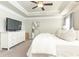 Spacious main bedroom with ceiling fan, dresser, and a large mirror creates an inviting, functional living space at 3133 Quinn Pl, Atlanta, GA 30341