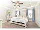 Serene main bedroom with tray ceilings, plush carpeting, and soft blue accents creates a peaceful retreat at 3133 Quinn Pl, Atlanta, GA 30341