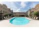 Inviting community pool surrounded by lounge chairs and well-maintained townhome exteriors at 3133 Quinn Pl, Atlanta, GA 30341