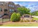 Community entrance sign 'Townsend at Ashford Park' with brick facade and manicured lawn at 3133 Quinn Pl, Atlanta, GA 30341