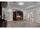 Basement entertainment area with wet bar, built-in cabinets, and ample space for recreation at 8630 Moor Park Run, Duluth, GA 30097