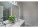 Bright bathroom with double sinks, a large mirror, and a glass-enclosed shower at 8630 Moor Park Run, Duluth, GA 30097