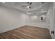 Bedroom with a large mirror on the wall and wood-look flooring at 8630 Moor Park Run, Duluth, GA 30097