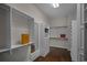 Well-organized walk-in closet with ample shelving, drawers, and hanging space, plus hardwood floors at 8630 Moor Park Run, Duluth, GA 30097