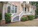 Close-up of the front entrance featuring an elegant white balustrade and decorative columns at 8630 Moor Park Run, Duluth, GA 30097