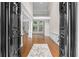 Grand foyer with soaring ceilings, hardwood floors, and an open view to the living spaces at 8630 Moor Park Run, Duluth, GA 30097