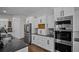 Kitchen featuring stainless appliances, granite countertops, double oven and custom cabinetry at 8630 Moor Park Run, Duluth, GA 30097