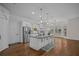 Gourmet kitchen features a large island, stainless steel appliances, and ample cabinet space at 8630 Moor Park Run, Duluth, GA 30097