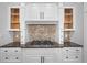 Gourmet gas range, granite counters, and custom cabinets make this kitchen a chef's dream at 8630 Moor Park Run, Duluth, GA 30097