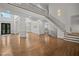Expansive living space with grand staircase, hardwood floors, large windows and statement front doors at 8630 Moor Park Run, Duluth, GA 30097