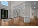 Spacious living room with hardwood floors, elegant lighting, and decorative columns at 8630 Moor Park Run, Duluth, GA 30097