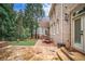 Flagstone and brick patio featuring a dining table, seamlessly blending indoor-outdoor living at 8630 Moor Park Run, Duluth, GA 30097