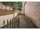 A beautiful brick walkway leads past the main house to the backyard of this lovely property at 8630 Moor Park Run, Duluth, GA 30097