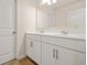 Bright bathroom featuring a dual sink vanity with shaker cabinets at 9990 Blackfriars Rd, Douglasville, GA 30135