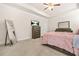 Bedroom view with a full length mirror, TV, a dresser, and a bed in soft lighting at 9990 Blackfriars Rd, Douglasville, GA 30135