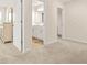 Bedroom with a view through the door to a bathroom with a vanity and mirror at 9990 Blackfriars Rd, Douglasville, GA 30135