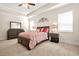 Bedroom featuring a bed with decorative pillows, a mirror, two bedside tables, and a dresser at 9990 Blackfriars Rd, Douglasville, GA 30135