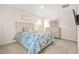 Bedroom featuring a floral quilt, a nightstand, a dresser, and a wall-mounted TV at 9990 Blackfriars Rd, Douglasville, GA 30135