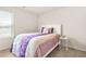 Cozy bedroom with a bed, window, and bedside table at 9990 Blackfriars Rd, Douglasville, GA 30135