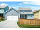 Charming two-story home with a two-car garage, well-maintained lawn and fence at 9990 Blackfriars Rd, Douglasville, GA 30135