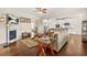 Bright living room with hardwood floors, a fireplace, and an open view to the kitchen at 9990 Blackfriars Rd, Douglasville, GA 30135