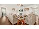 Open living area featuring hardwood floors, a fireplace, and comfortable sofas at 9990 Blackfriars Rd, Douglasville, GA 30135