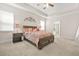 Spacious bedroom with a tray ceiling, large bed, and an en-suite bathroom at 9990 Blackfriars Rd, Douglasville, GA 30135