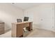 Home office featuring a desk, chair, door, and window providing natural light at 9990 Blackfriars Rd, Douglasville, GA 30135