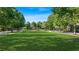 Lush community park lined with mature trees and walking paths, offering a serene outdoor space at 9990 Blackfriars Rd, Douglasville, GA 30135