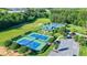Aerial view of tennis courts surrounded by lush greenery, offering a great recreational amenity at 9990 Blackfriars Rd, Douglasville, GA 30135