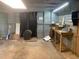Unfinished basement with concrete floor and work space at 106 E Wade St, Oxford, GA 30054
