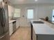 Updated kitchen with stainless steel appliances, white cabinetry, and sleek countertops at 106 E Wade St, Oxford, GA 30054